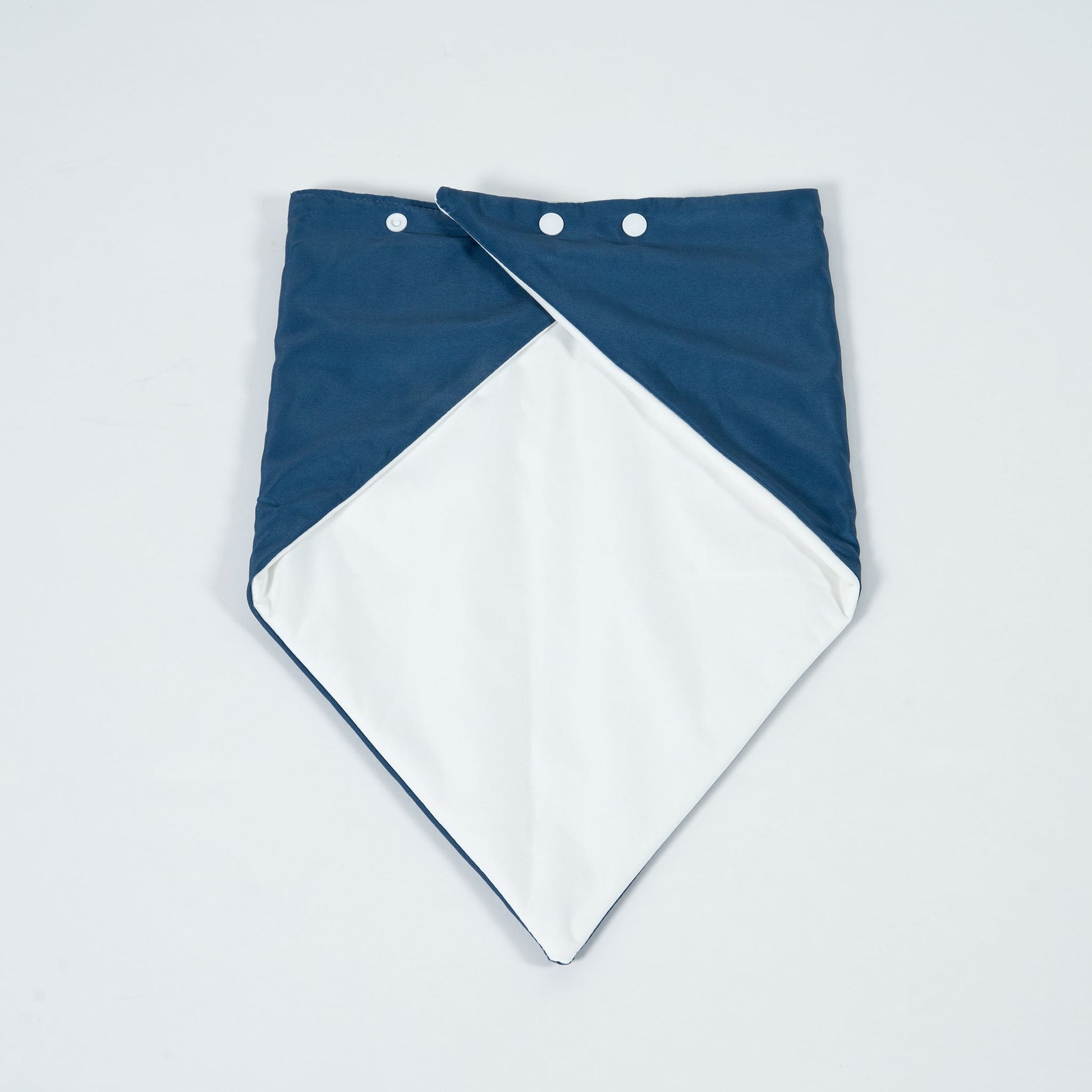 A navy bandana lying flat on a table