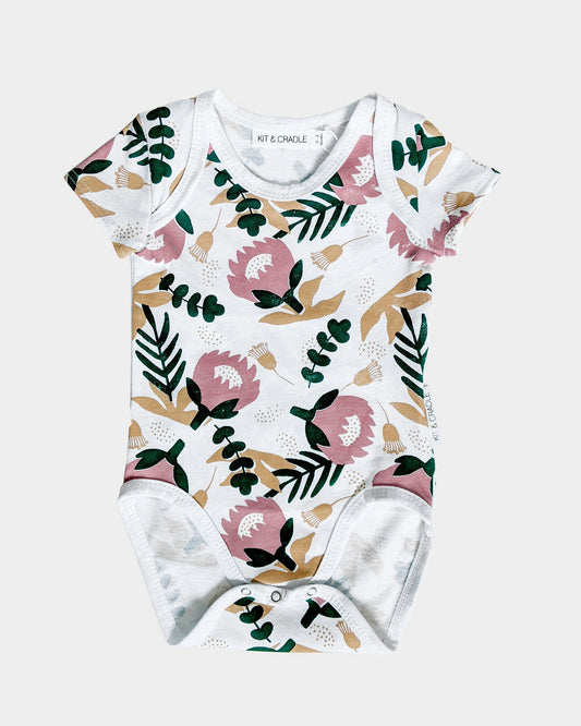 Protea print baby girl onesie